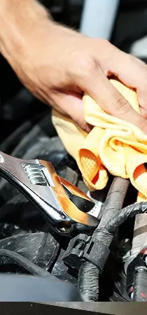 Bentley Continental Engine Removal - close up view of mechanic working on car